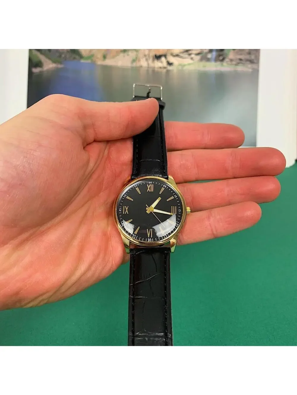 Minimalistic Black essential vintage style gold and leather style band watch. 9